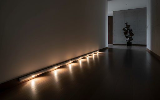 High-definition luxury interior photography of Cat-Eye Hill sensor lights in a dark modern hallway.